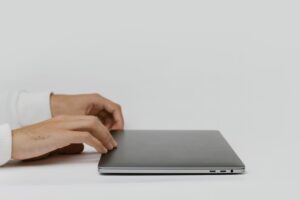 close up shot of a person using a laptop